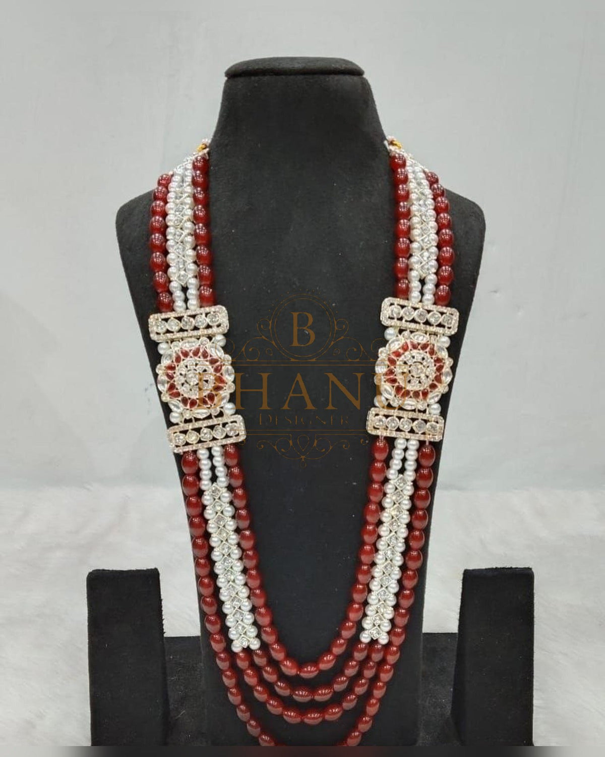 Mala necklace shown on a display stand