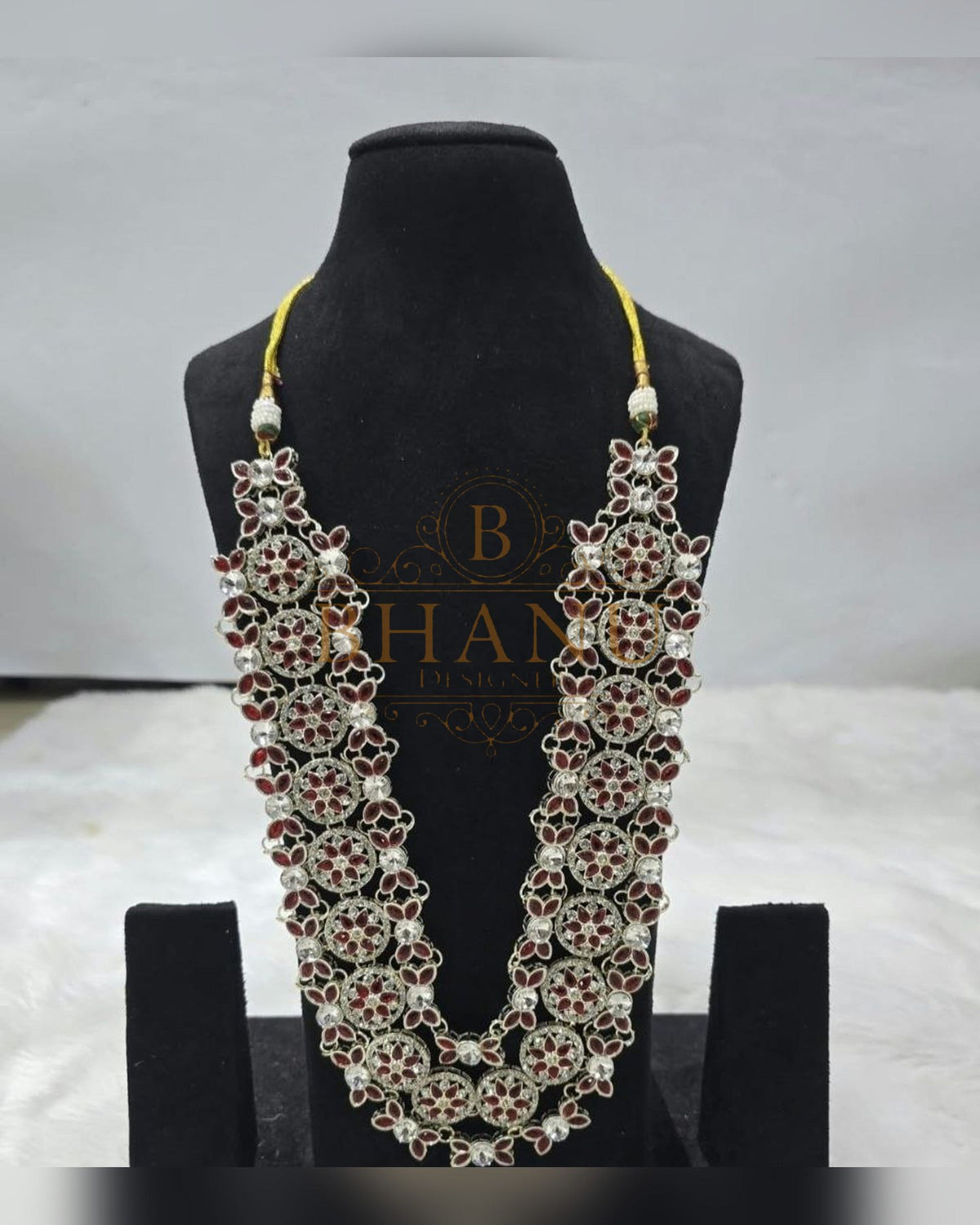 Mala necklace shown on a display stand