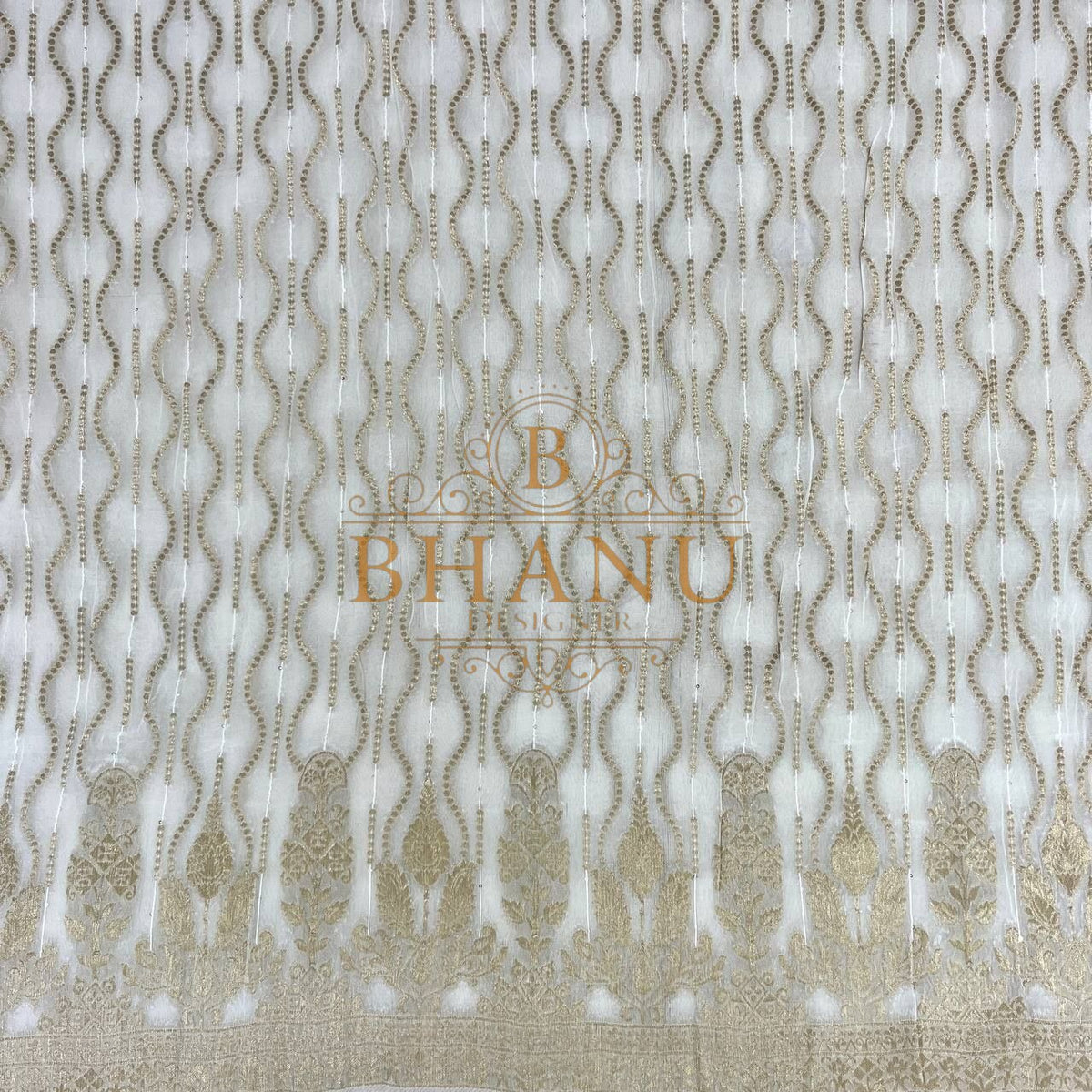 Ivory net with gold teardrops and a heavy border - fabric by the metre