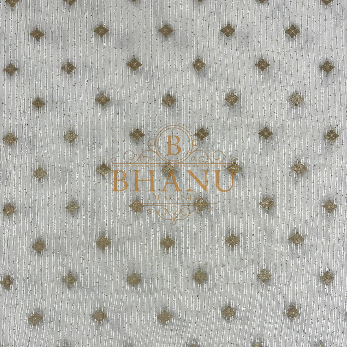 Ivory with scattered gold diamond butti - fabric by the metre