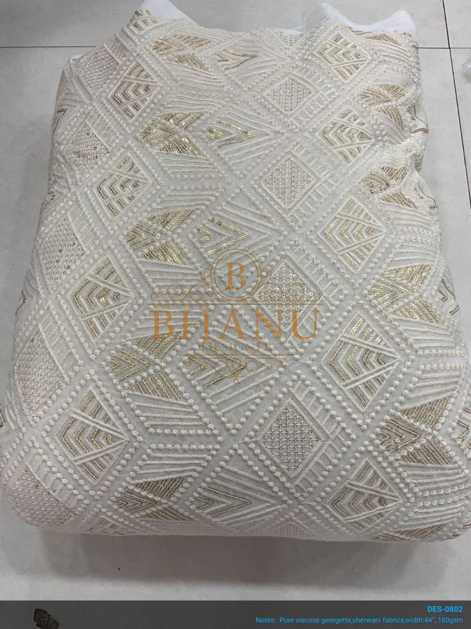 Ivory geometric cutwork lace in gold - fabric by the metre