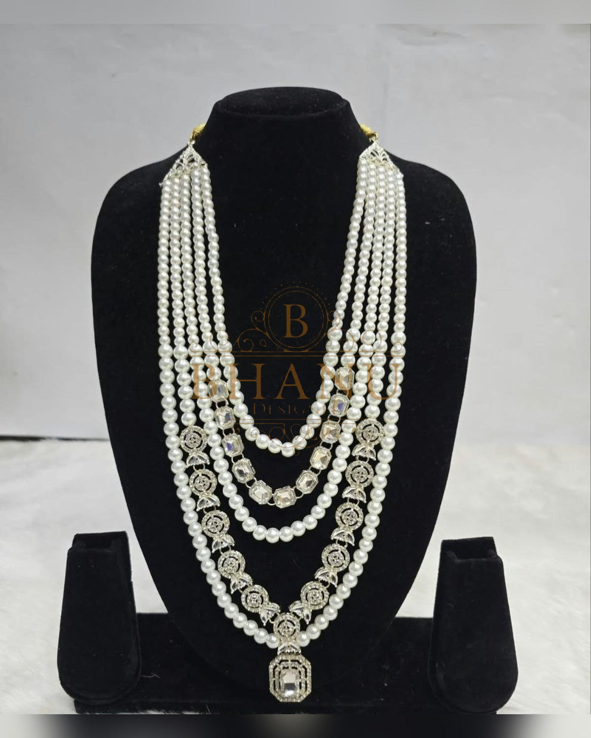 Mala necklace shown on a display stand