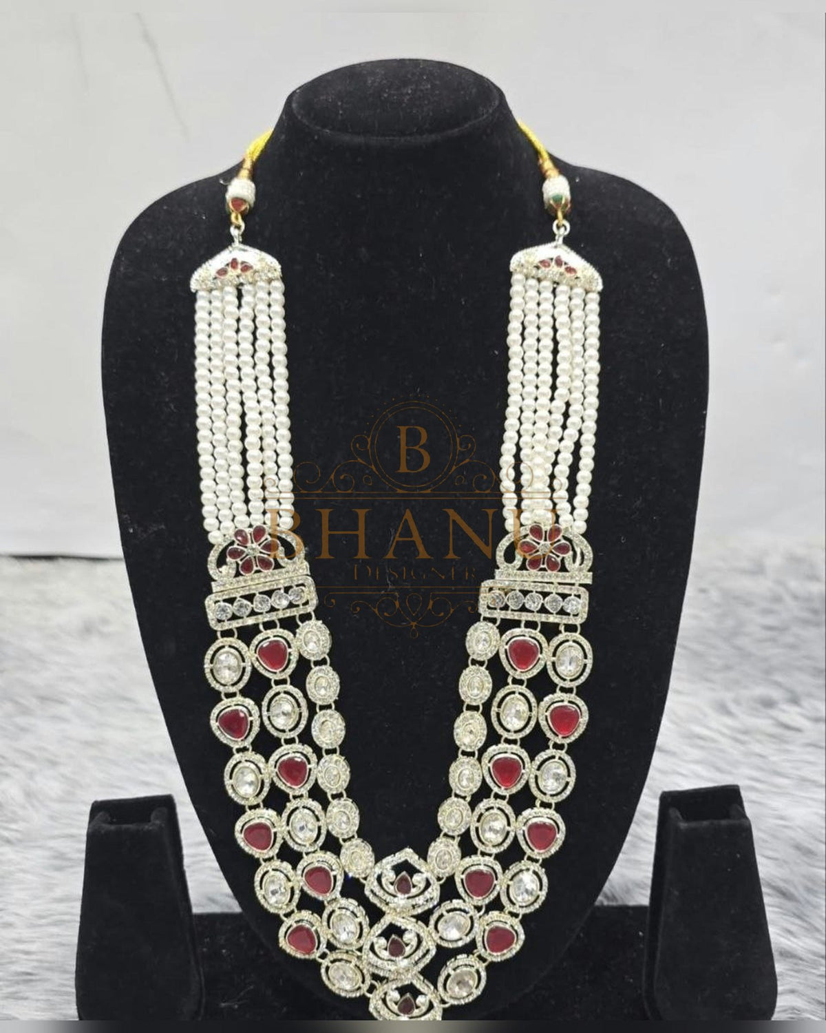 Mala necklace shown on a display stand