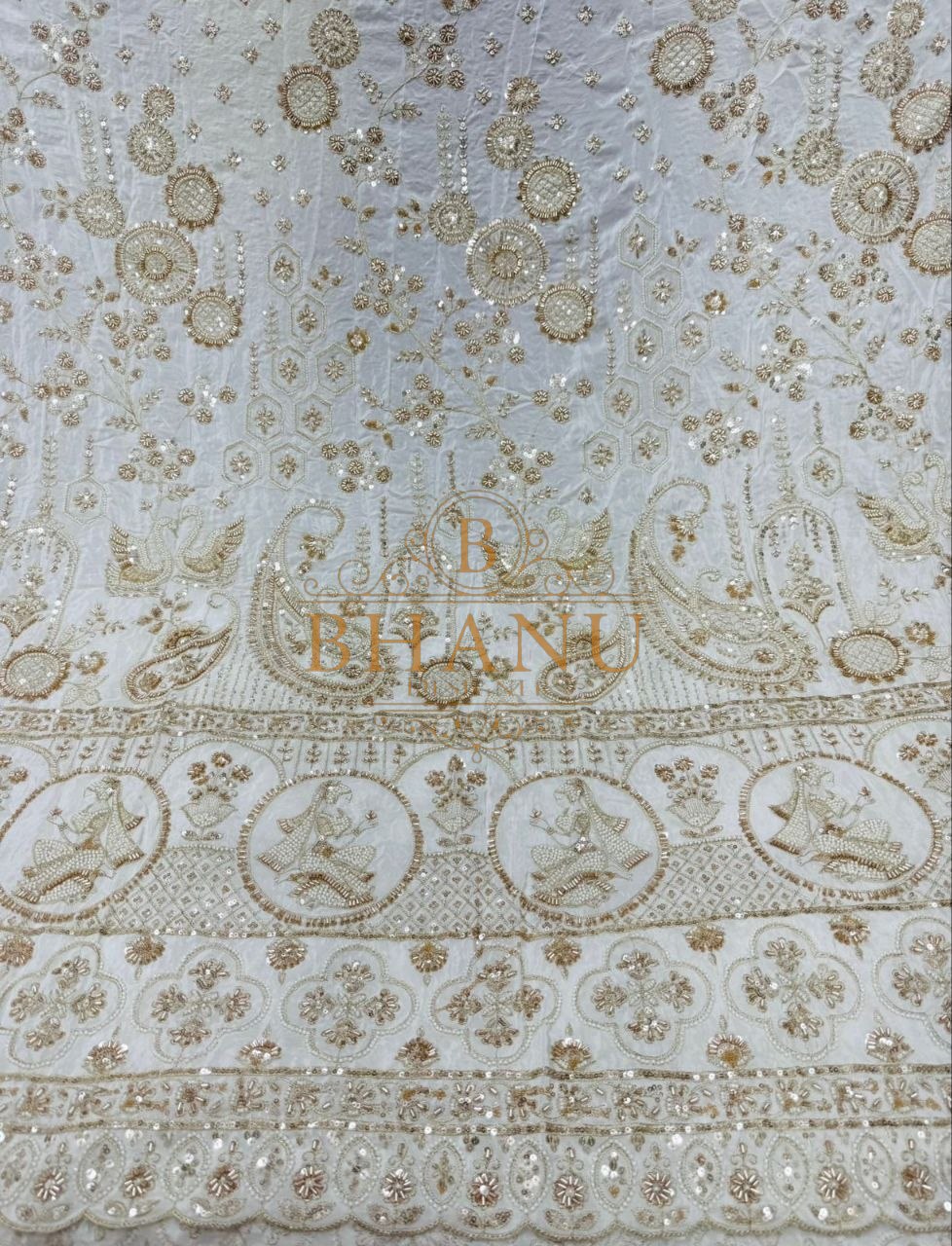 Ivory with gold peacock and paisley border - fabric by the metre