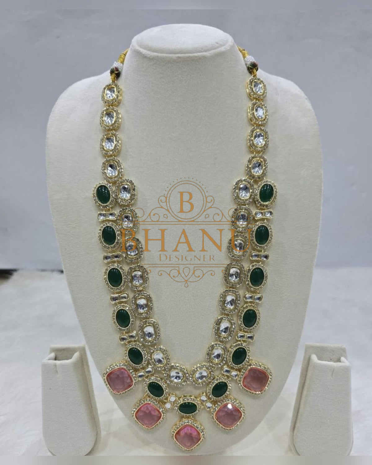 Mala necklace shown on a display stand