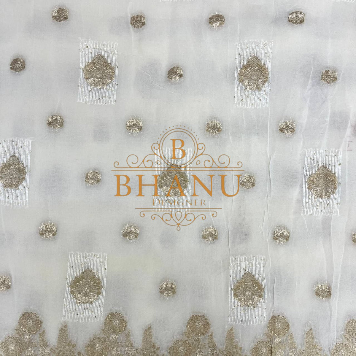 Ivory with gold butti and a gold border - fabric by the metre