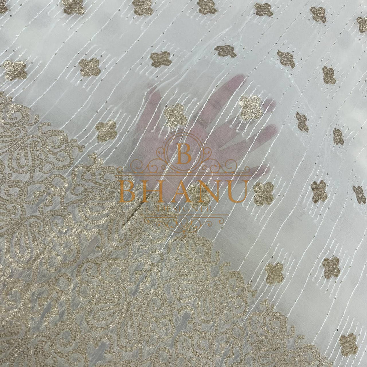 Ivory with gold butti and a gold border - fabric by the metre