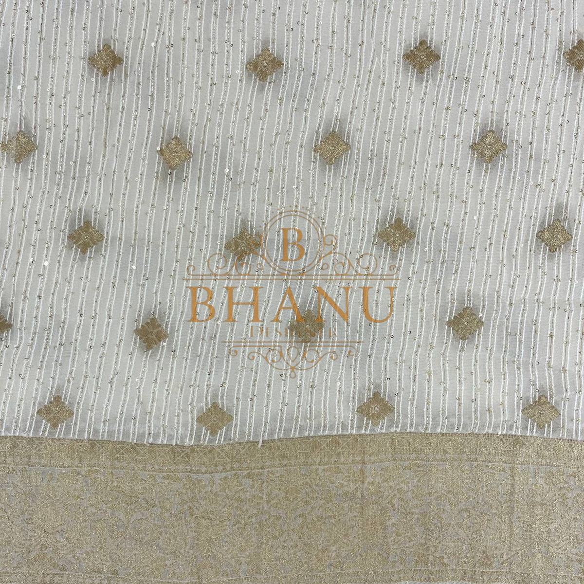 Ivory with gold butti and a gold border - fabric by the metre
