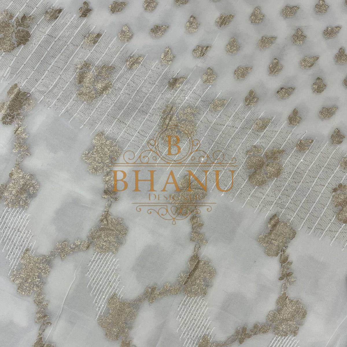 Ivory with gold cluster embroidery on sheer ground - fabric by the metre