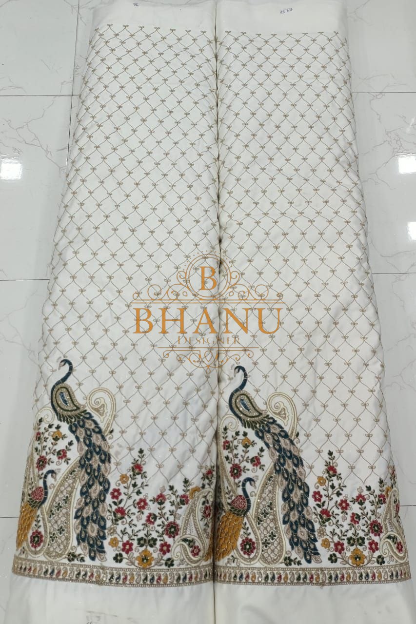 White with peacock and floral work at the hem - unstitched panel