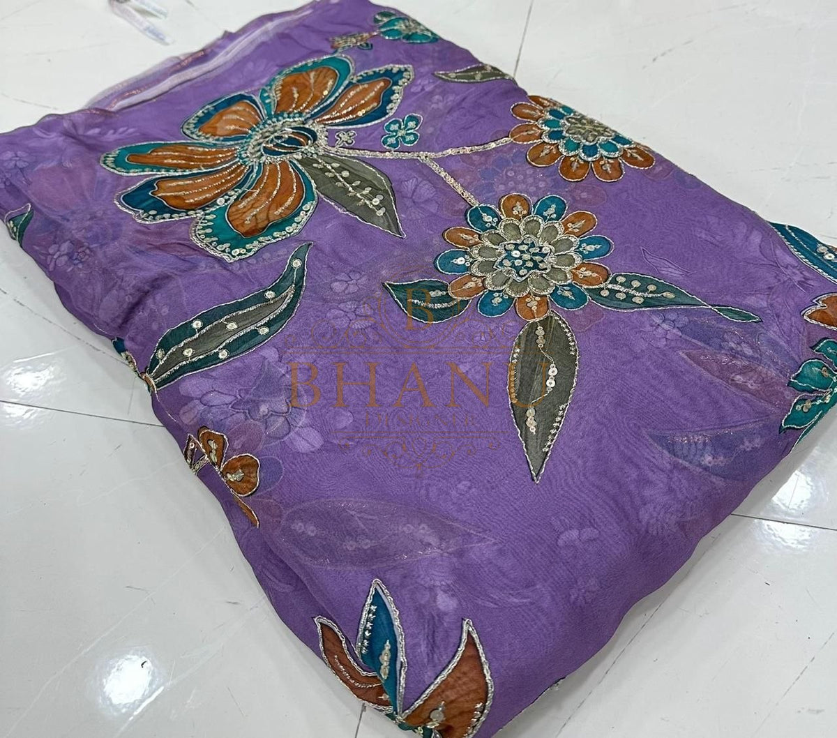 Lilac with orange and teal floral applique - fabric by the metre