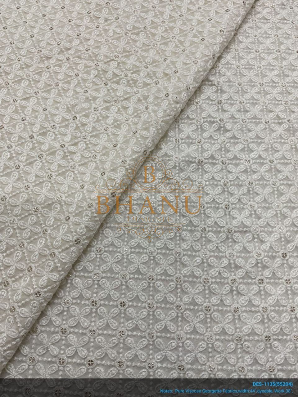 Ivory with tonal eyelet cutwork - fabric by the metre