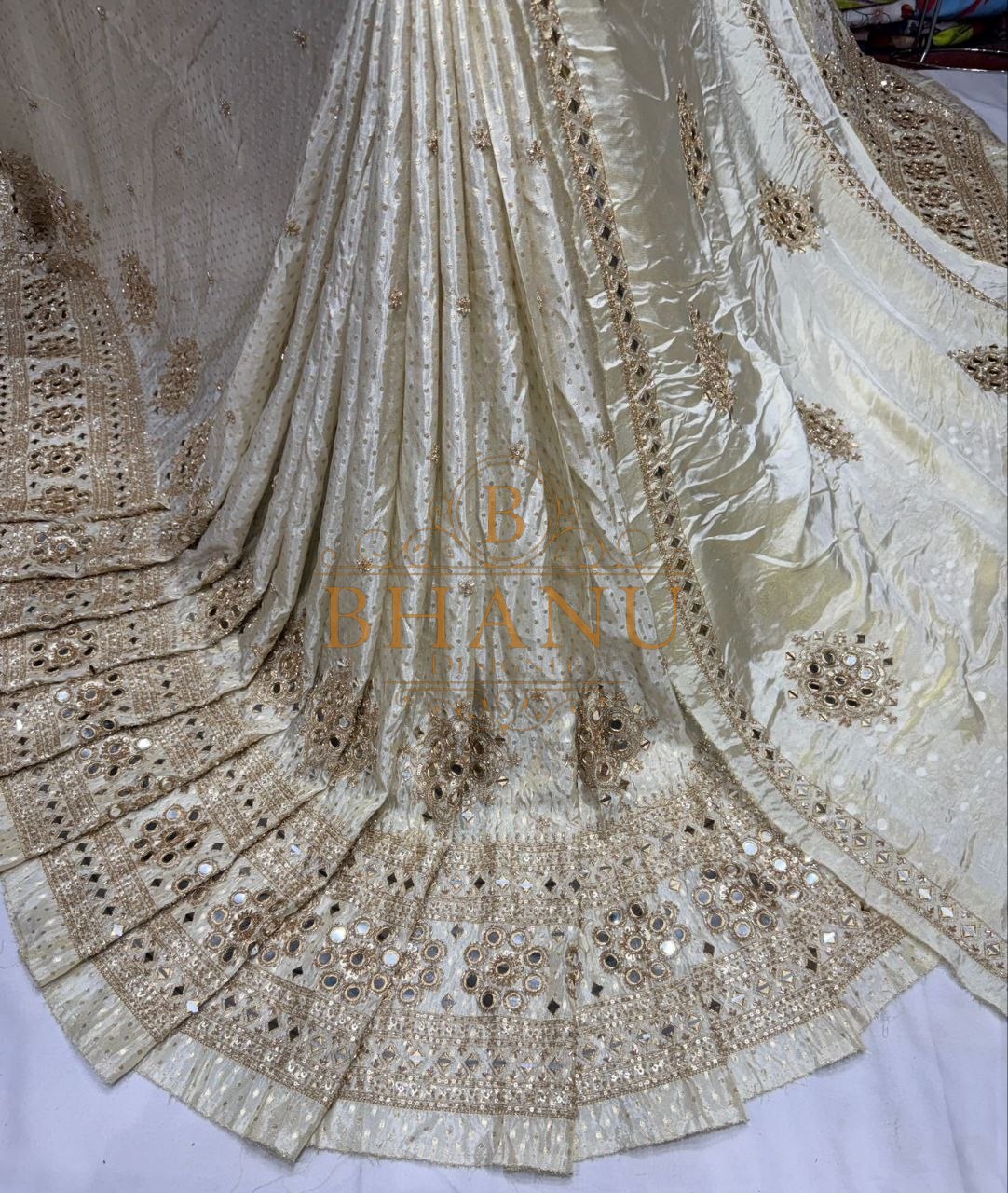 Ivory with a gold sequin border - fabric by the metre