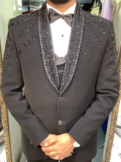Dark gray embroidered jacket worn by a person at bhanu designer