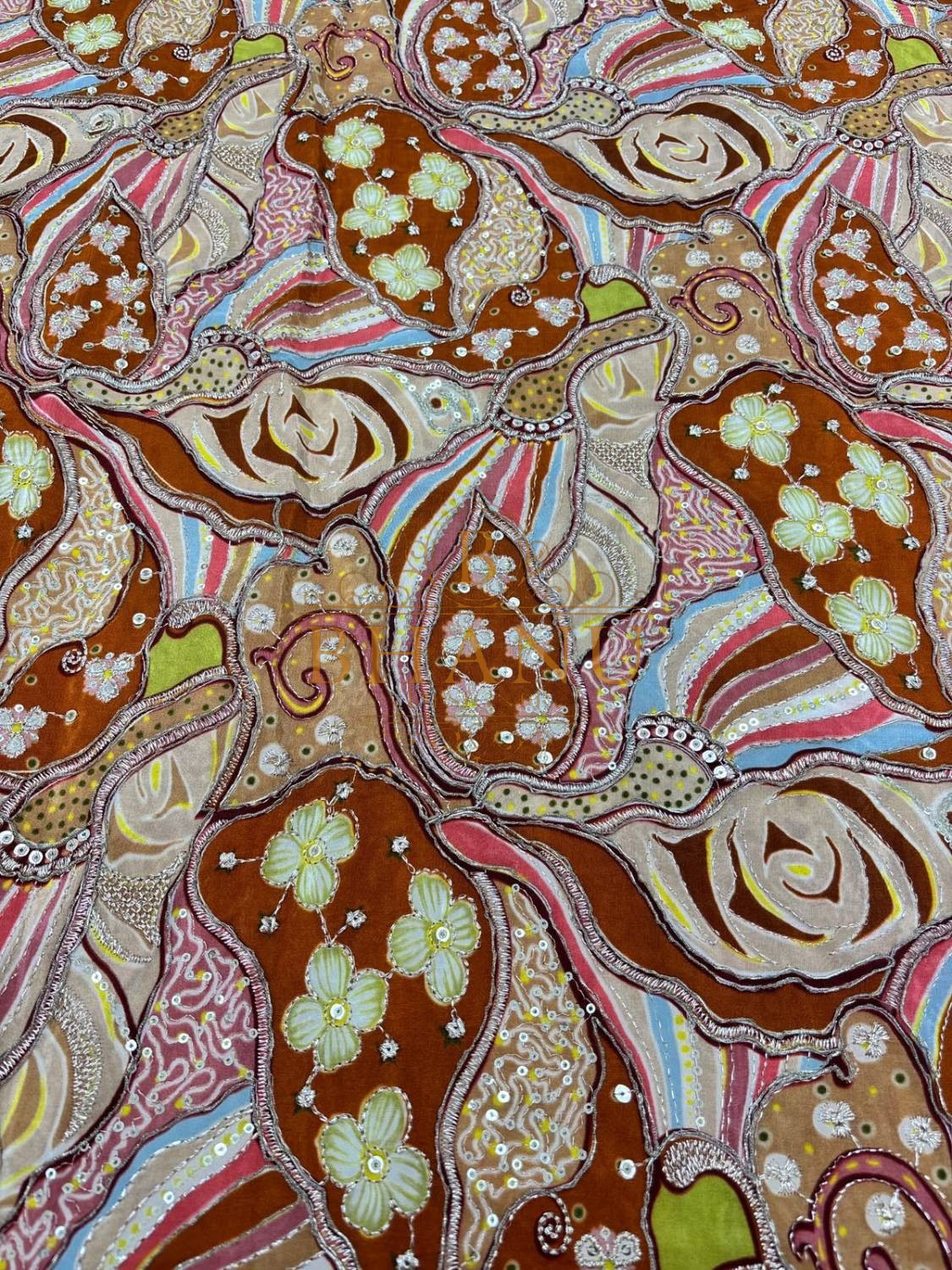 Rust crepe with printed roses, gold cording and sequins