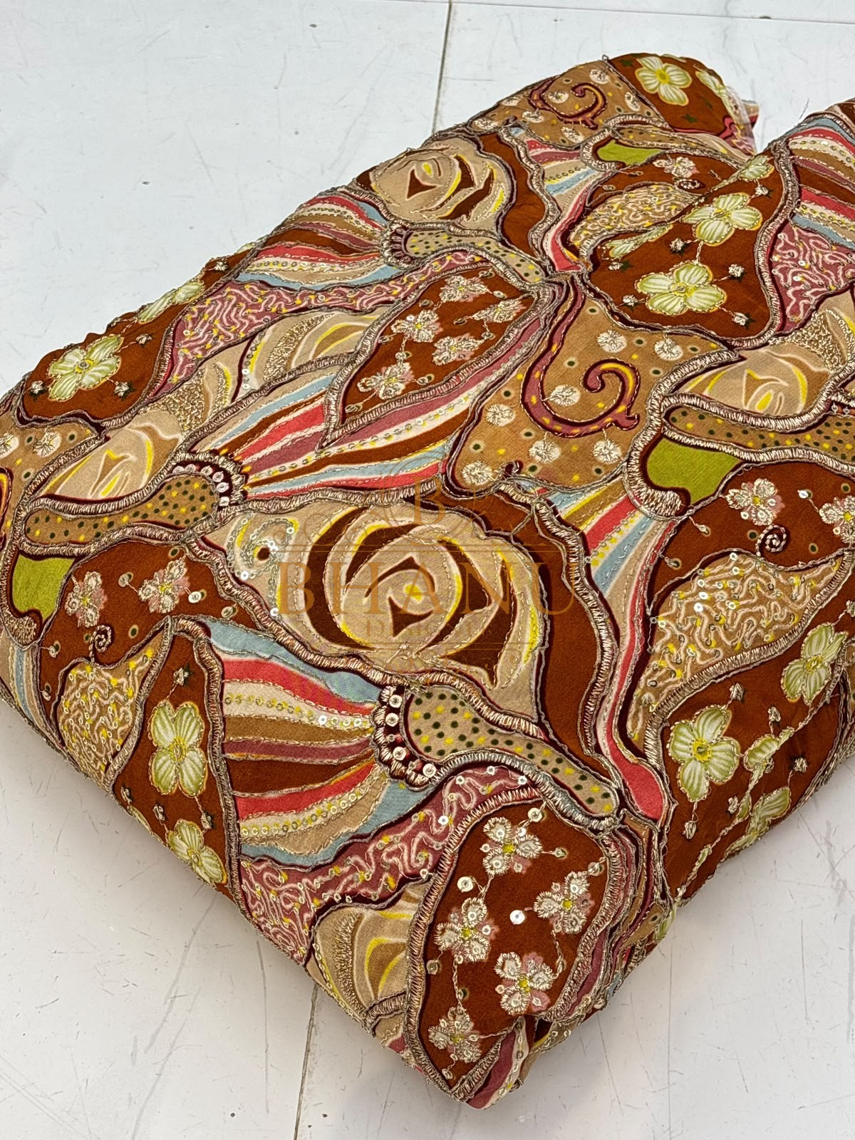 Rust crepe with printed roses, gold cording and sequins