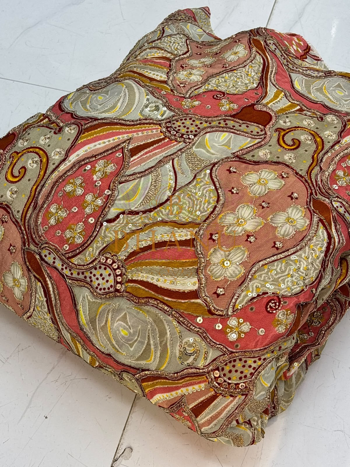 Coral and grey crepe with printed roses, gold cording and sequins