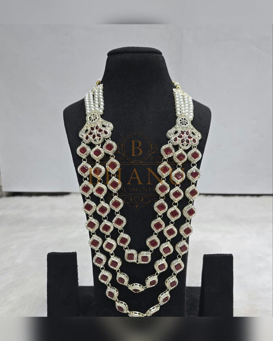 Mala necklace shown on a display stand
