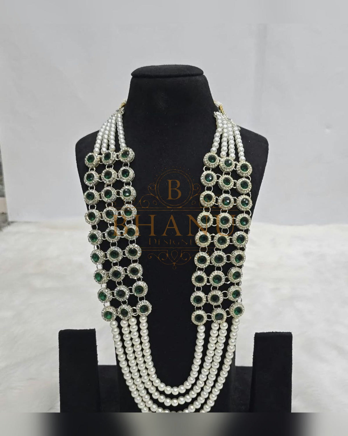 Mala necklace shown on a display stand