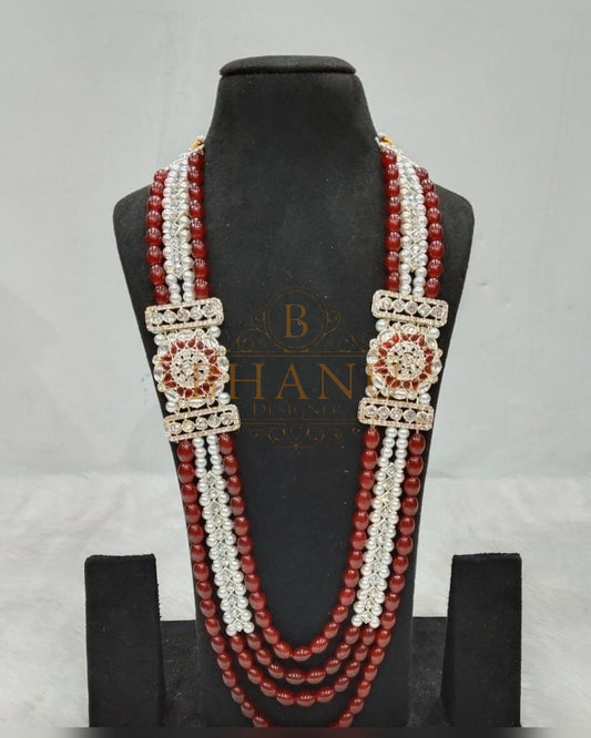 Mala necklace shown on a display stand