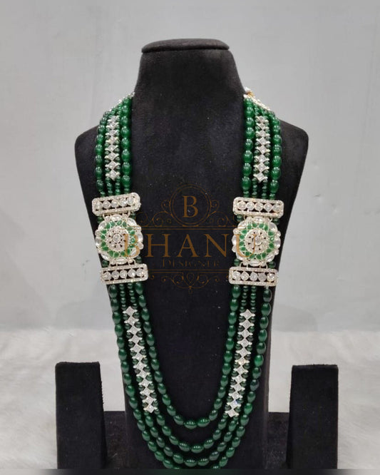 Mala necklace shown on a display stand