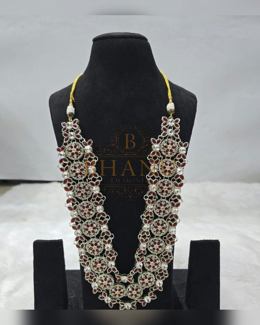 Mala necklace shown on a display stand