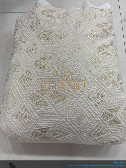 Ivory geometric cutwork lace in gold - fabric by the metre