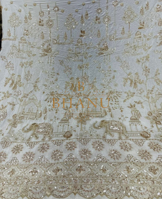 Gold thread elephant and floral work on sheer cream - fabric by the metre