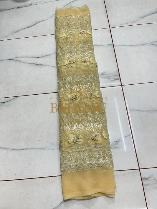 Gold embroidered length on pale gold tissue - fabric by the metre