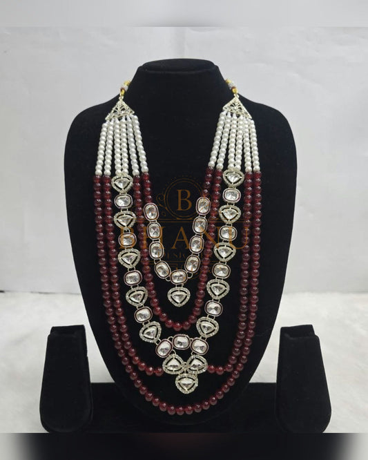Mala necklace shown on a display stand