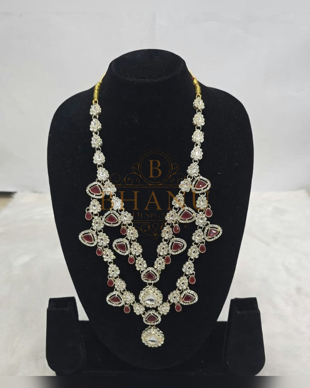 Mala necklace shown on a display stand