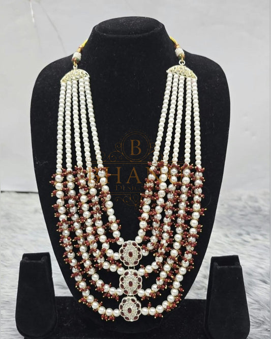 Mala necklace shown on a display stand