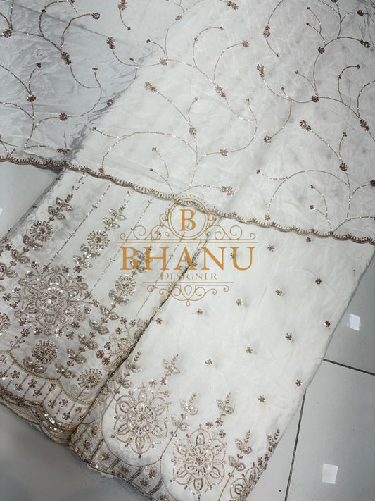 Ivory with scattered gold work, folded from the roll - fabric by the metre