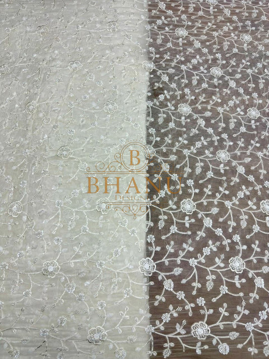 Ivory with fine floral embroidery on net - fabric by the metre