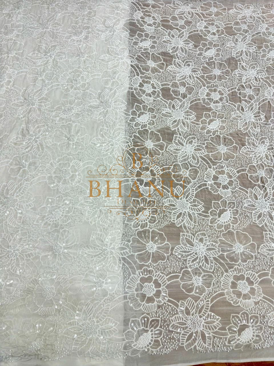 Ivory with scalloped floral net work - fabric by the metre