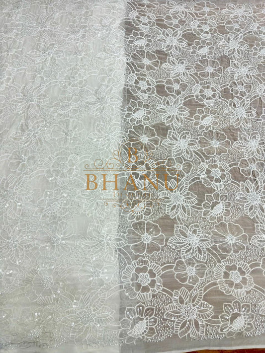 Ivory with scalloped floral net work - fabric by the metre