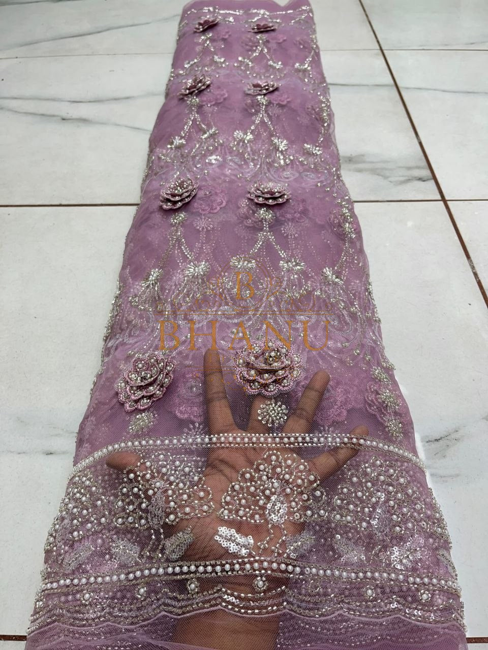 Lilac net with raised floral applique - fabric by the metre