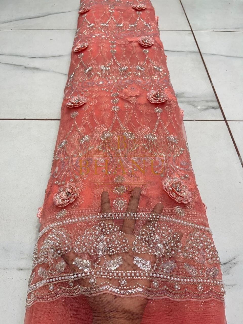 Coral net with raised floral applique - fabric by the metre