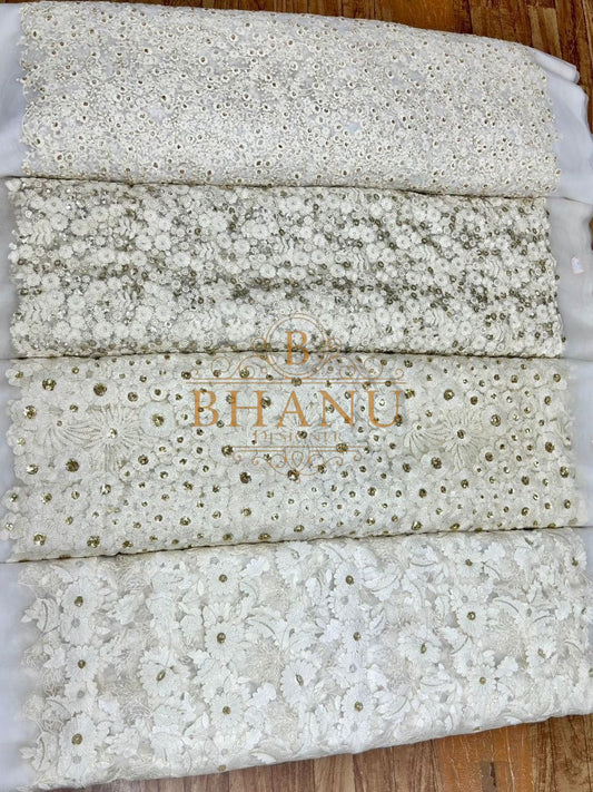 Ivory in layered cutwork and mirror bands - fabric by the metre