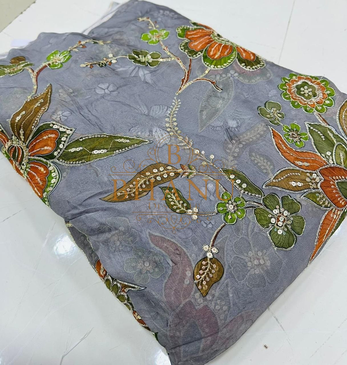 Grey with orange and olive leaf work, second colourway - fabric by the metre