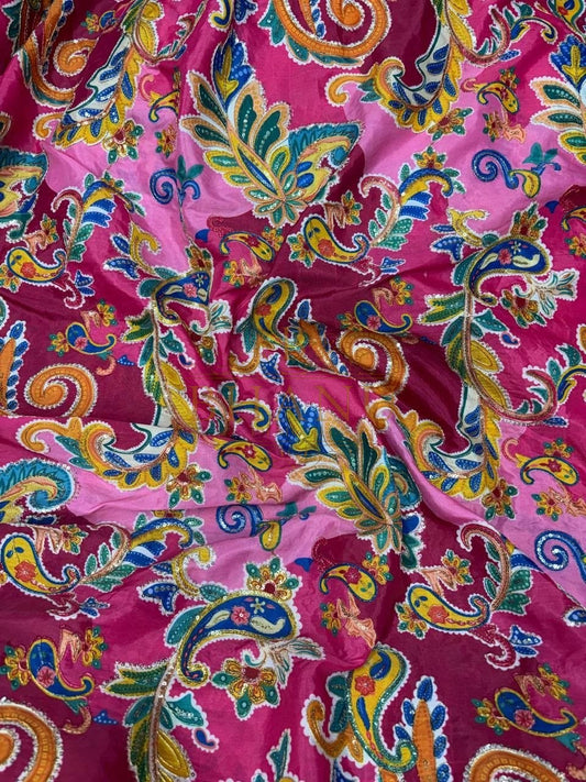 Magenta with a multicolour paisley print - fabric by the metre