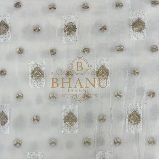 Ivory with gold butti and a worked hem - fabric by the metre