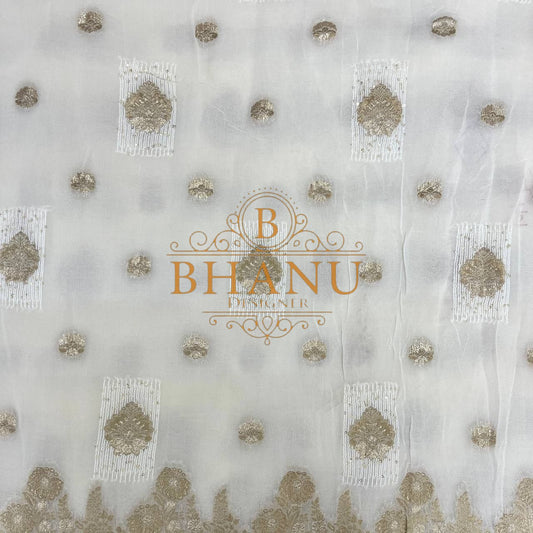 Ivory with gold butti and a gold border - fabric by the metre