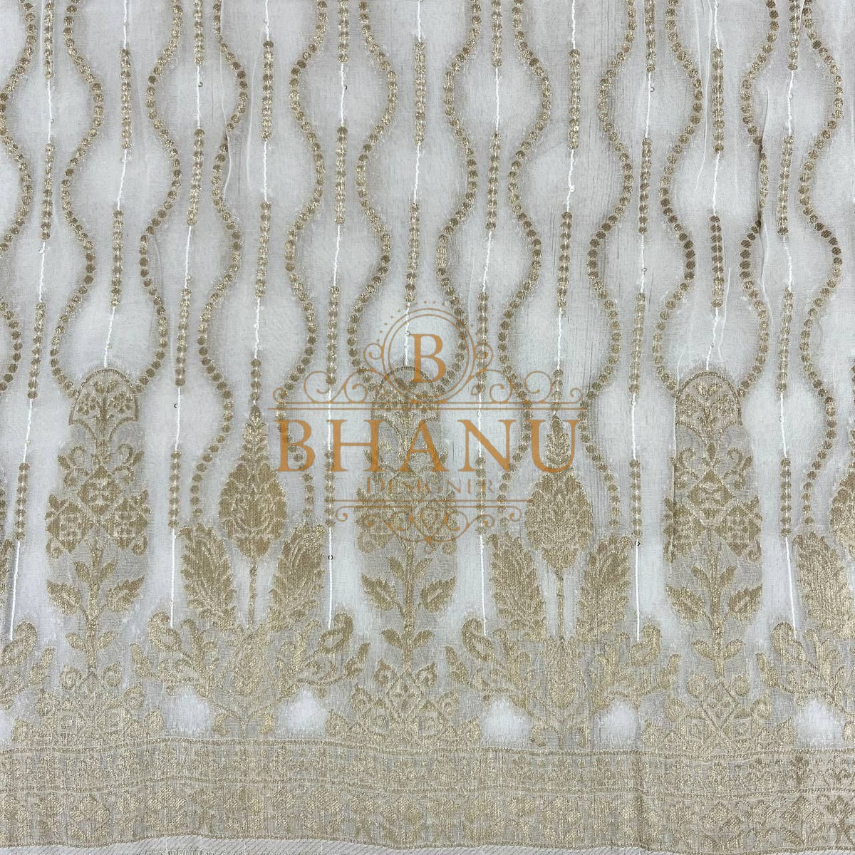 Ivory with gold teardrop columns above a border - fabric by the metre