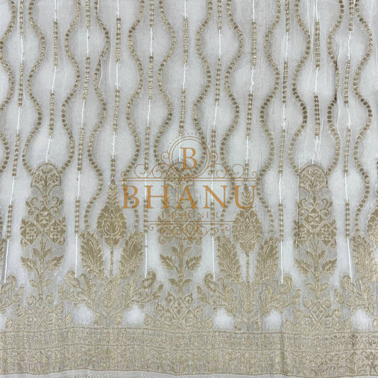 Ivory with gold teardrop columns above a border - fabric by the metre
