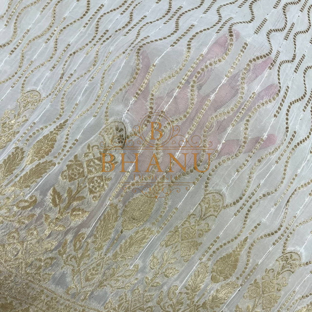 Ivory with gold wave work over a pink undertone - fabric by the metre