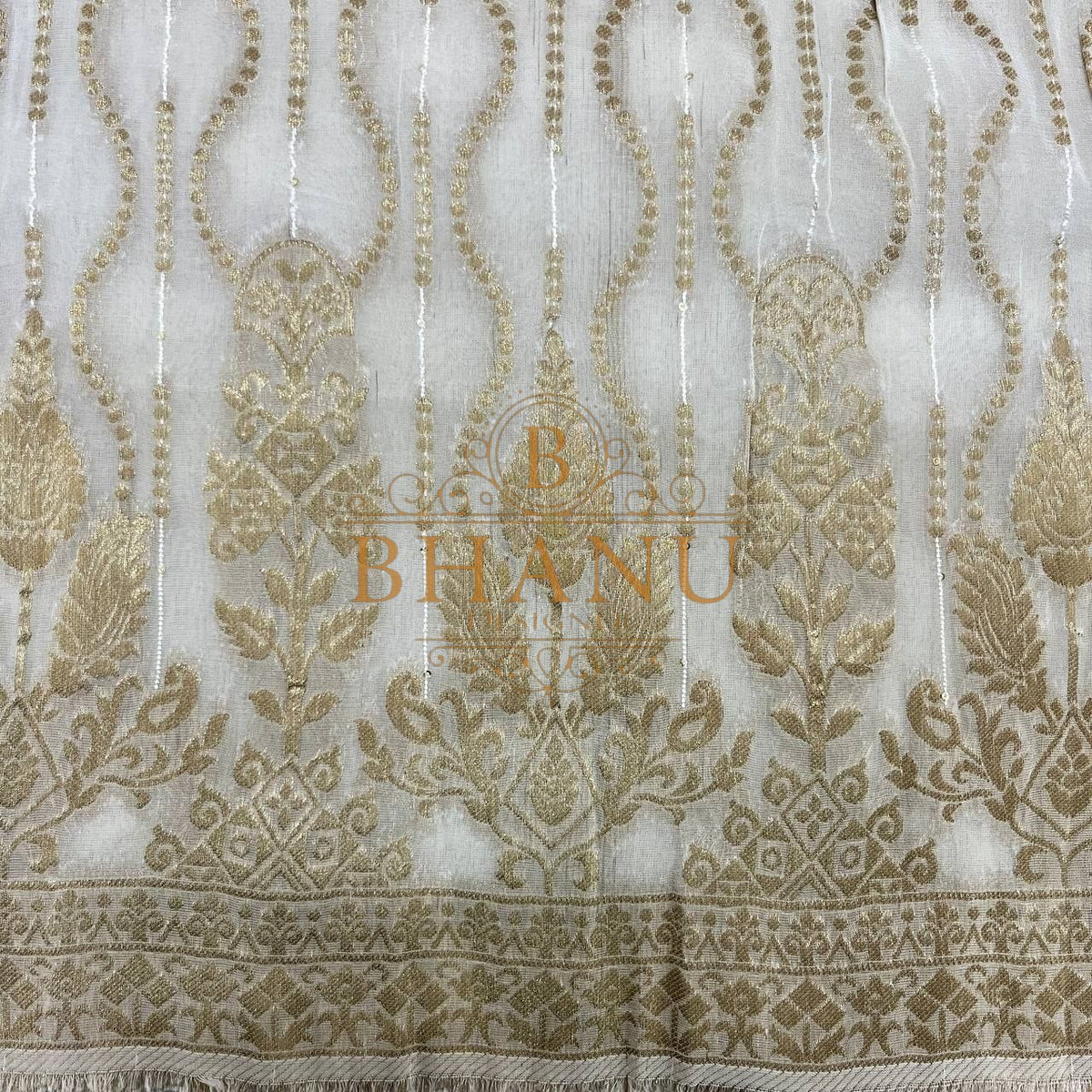 Ivory with gold teardrop columns and a heavy border - fabric by the metre
