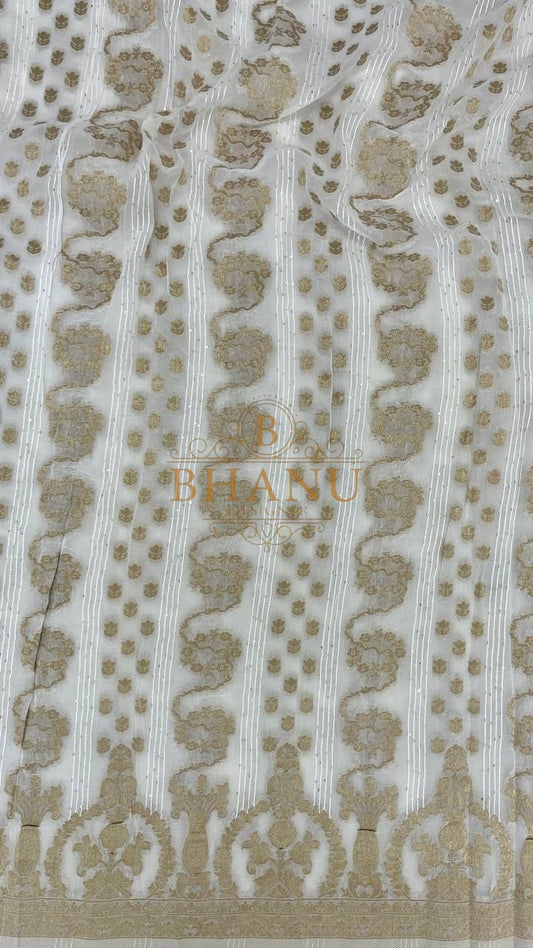Ivory with gold column work and an arched hem - fabric by the metre