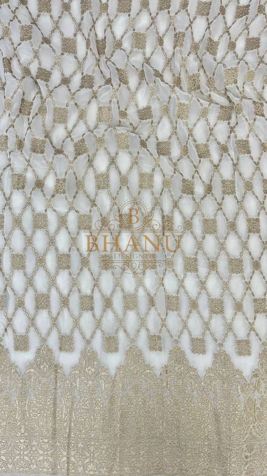Ivory with gold lattice and a scalloped hem - fabric by the metre