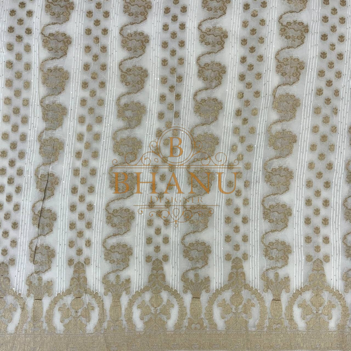 Ivory with gold columns and an arched hem - fabric by the metre